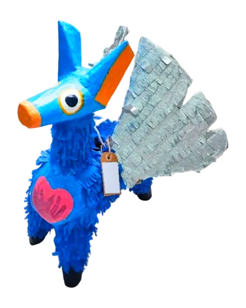 Piñata de burrito azul con alas plateadas de flecos metalizados, orejas puntiagudas, hocico naranja y un corazón rosa en el costado, recortada sobre fondo liso.